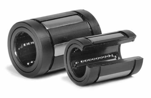 Two plastic linear ball bearings, one solid and one open type, showing internal ball bearing rows.