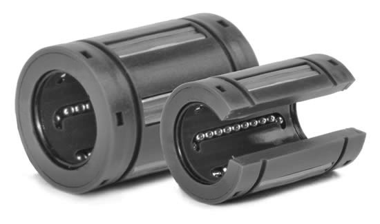 Two polymer linear ball bearings, one closed and one open, with visible ball tracks.