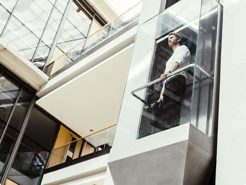 Glass elevator with PTFE plain bearing application