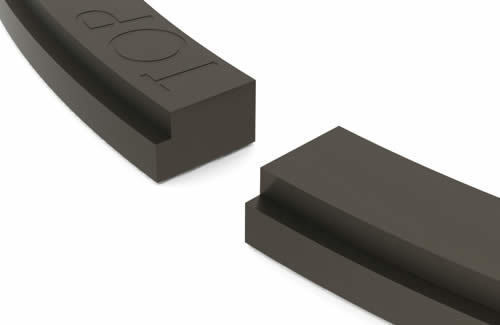 Close-up of piston ring with top mark and profile shape for installation in combustion engine